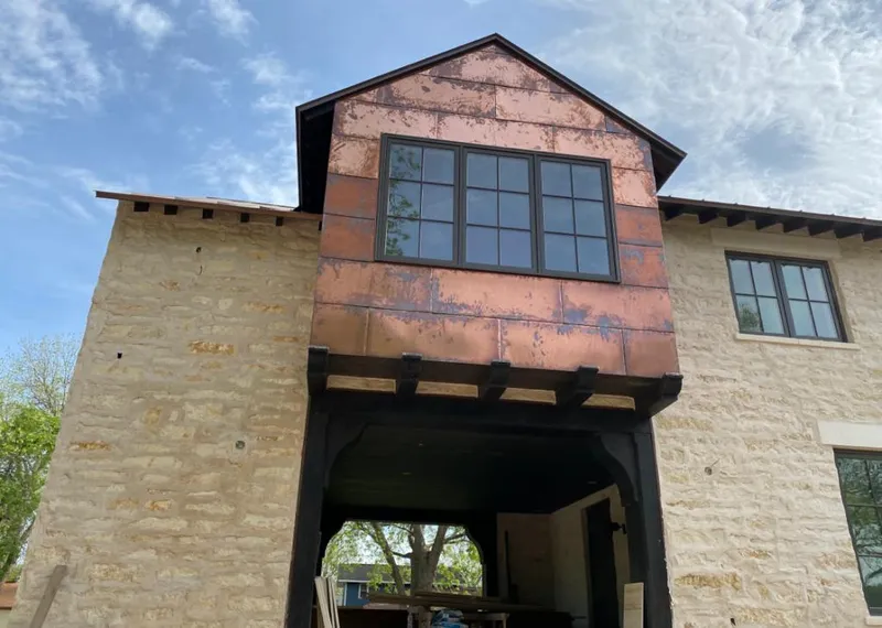 Copper metal panel facade on a stone building for Skylight Installation in Port Chester